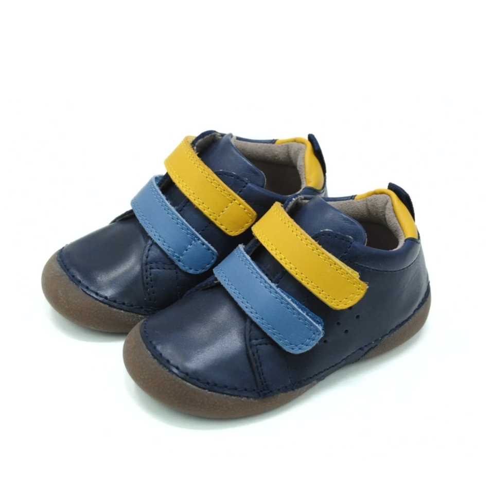 Pair of blue and yellow children's shoes on a white background